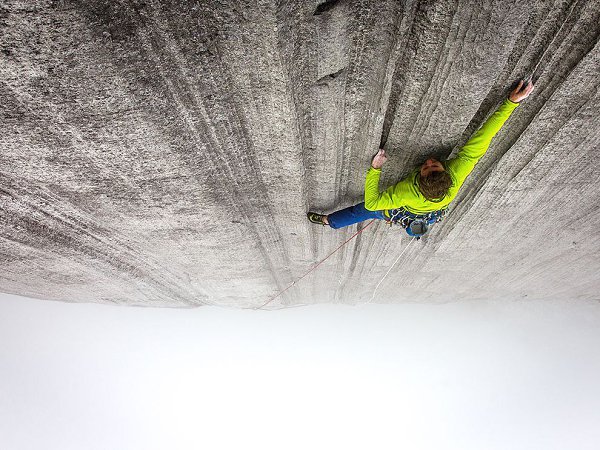 Tommy Caldwell climbing Interlaken in the clouds